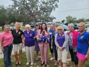 Female Veterans folding Old Glory in preparation of Nicole